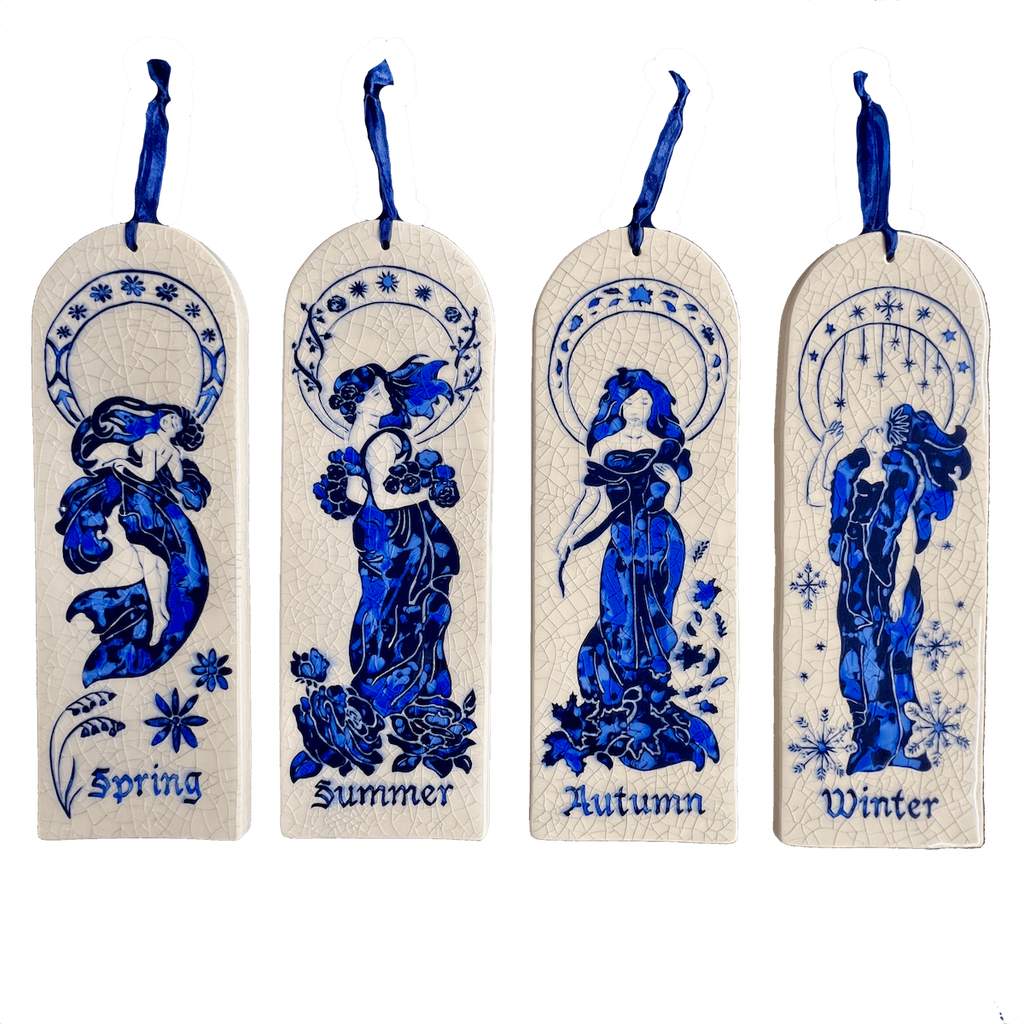 Four arch ceramic tiles hand carved with four Art Nouveau women representing Spring, Summer, Autumn, and Winter on a crackle glaze background.