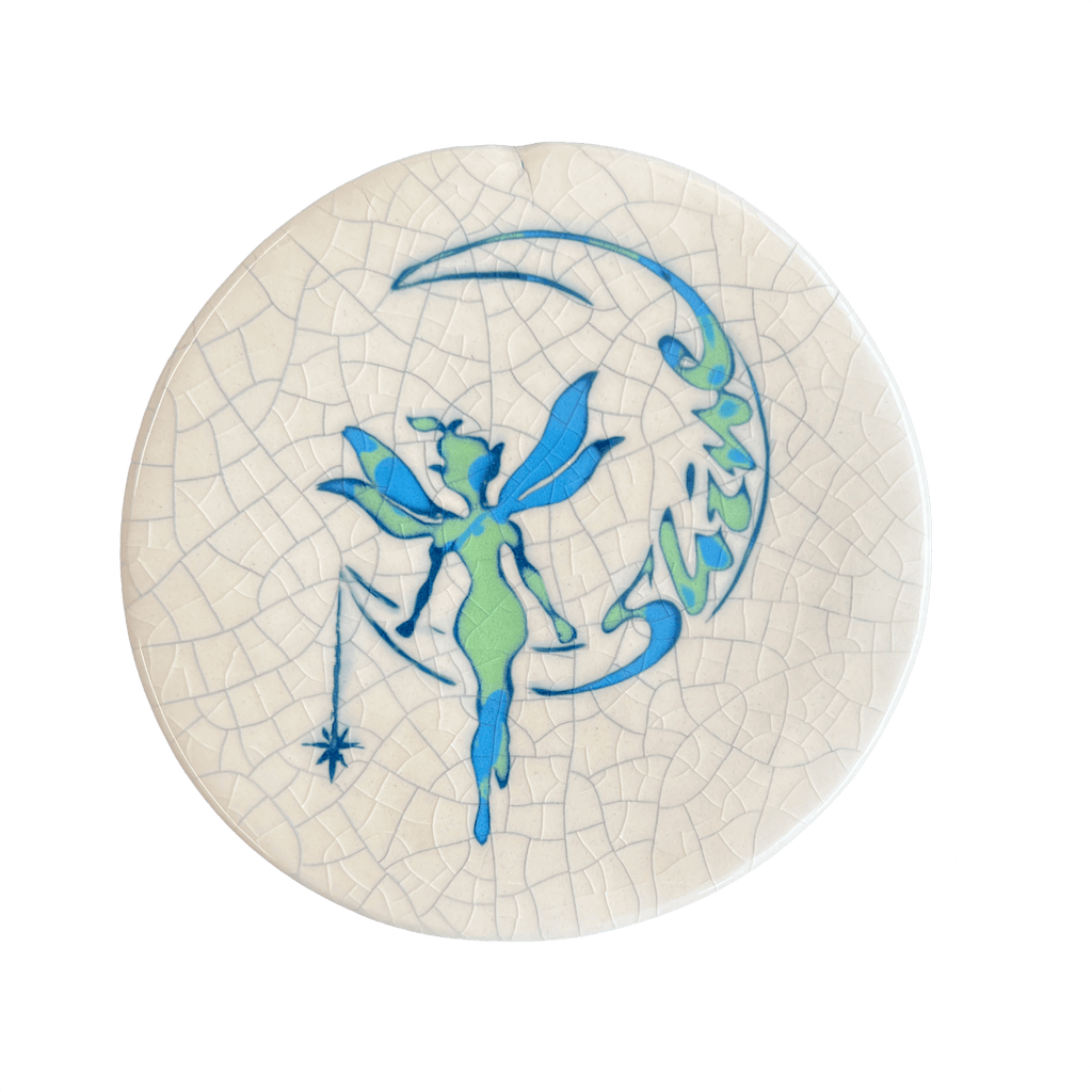 Decorative plate with a fairy design on a cracked white background