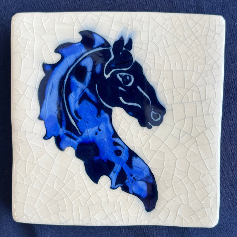 Square ceramic coaster with a blue horse design on a crackle glaze background