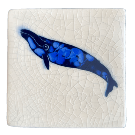 Square ceramic coaster with a blue whale design on a crackle glaze background
